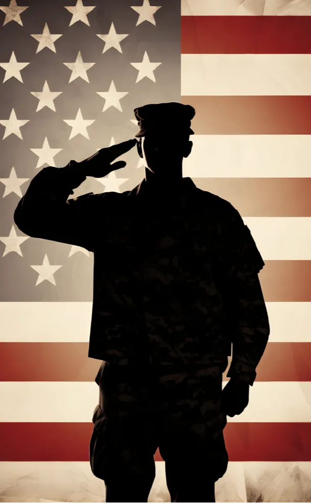 Silhouette of a saluting soldier in front of an American flag